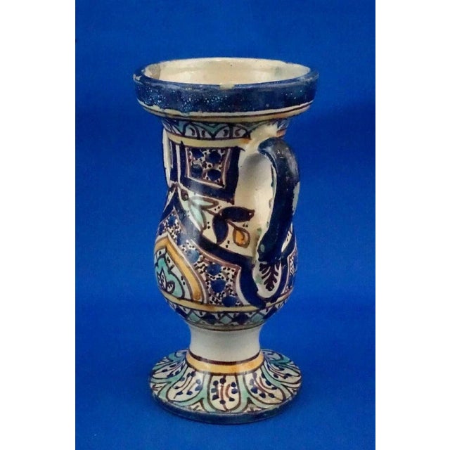 Measurements: height: 21 cm; width: 13.5 cm; depth: 10.5 cm item : a rare, small, two-handled amphora in polychrome...