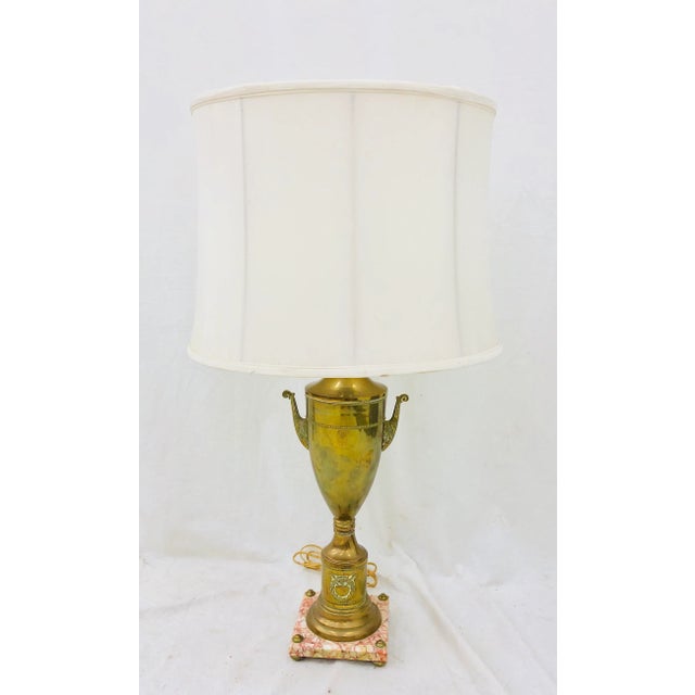 Stunning Vintage French Style Lamp on Marble Base. Gorgeous Urn shape with wreath and bow emblem at brass base. Original...