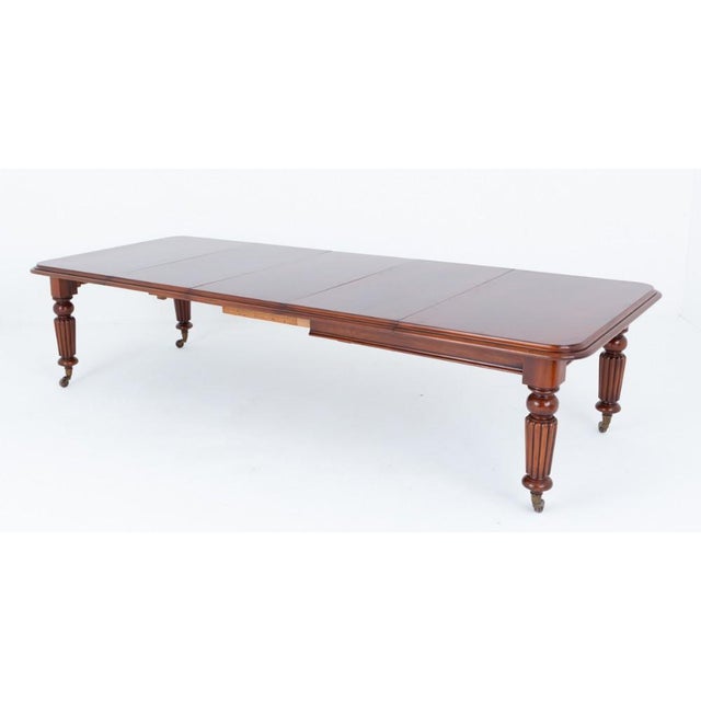 Of fine scale and excellent quality, this William IV mahogany dining table is raised upon elegant ring-turned and fluted...