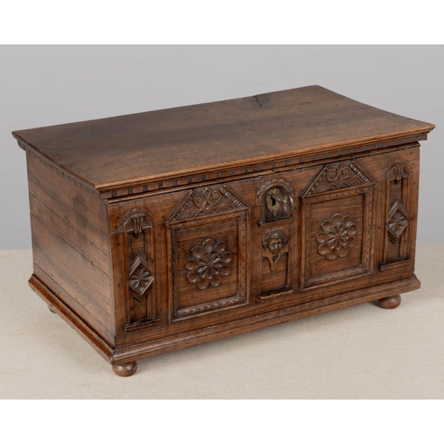 An early 19th century Spanish Baroque style carved walnut marriage chest, or wedding coffer. Fine hand-carving with...