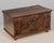 An early 19th century Spanish Baroque style carved walnut marriage chest, or wedding coffer. Fine hand-carving with...