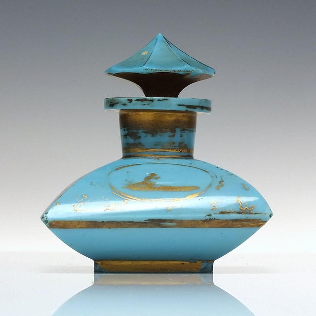 A superb and very rare 19th-century French perfume bottle in light Opaline blue. It has its original gilded mushroom...