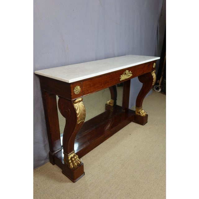 19th Century Console Table Large Restoration period console table in mahogany and giltwood. This console table features an...