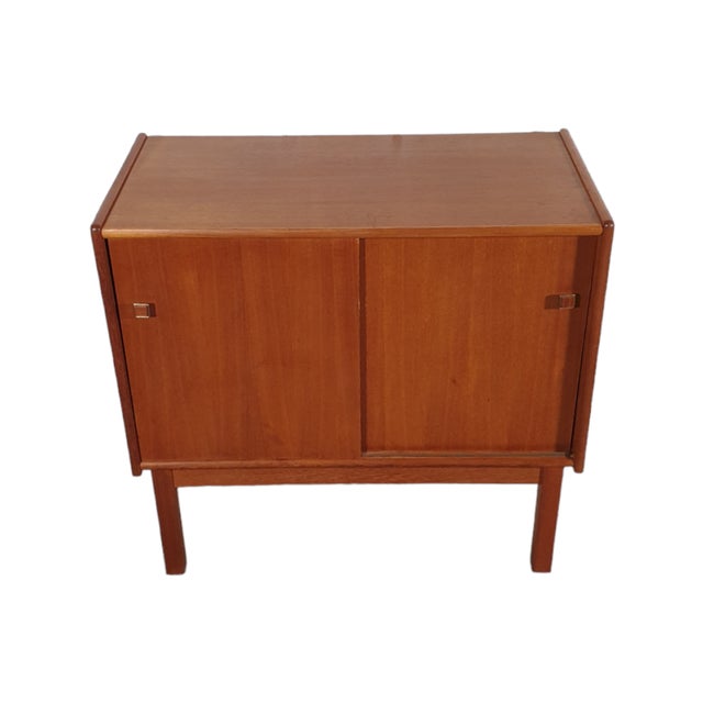 Sideboard in teak veneer from Sweden. Produced in the 80's. Delicate scratches on the countertop caused by use. White...