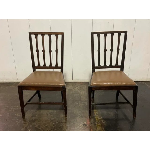 Pair of vintage side chairs with leather upholstered seats. perfect for dining, desk or extra side chairs seating in any...