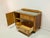 This stylish vintage chest of drawers from the 1950s impresses with its clean lines and charming details. A glass top...