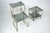 Elegant set of three nesting side tables crafted in lightly gilded aluminum with glass tops, produced in Italy during the...