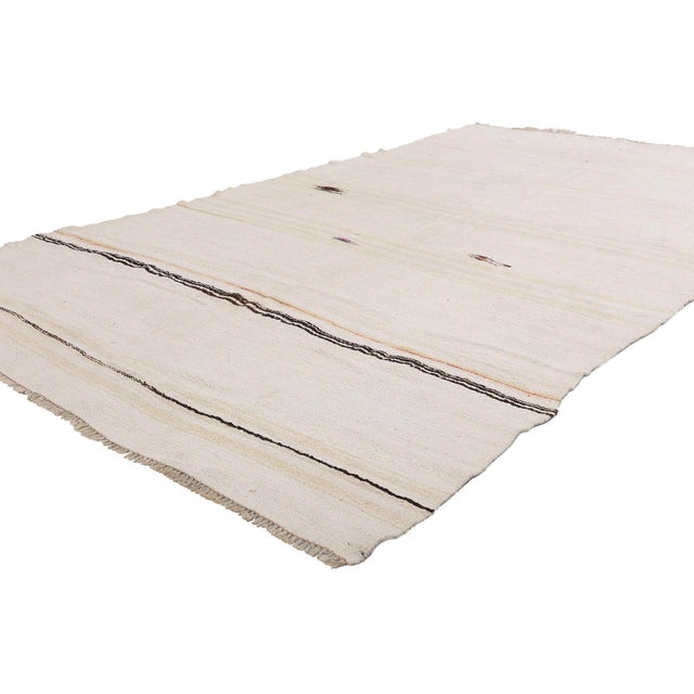 52621 Vintage Turkish Kilim Area Rug, 05'09 x 09'11. Soft as the whispers of Anatolian winds and woven with the quiet...