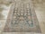 This mid-20th-century Persian Malayer accent rug presents a balanced floral and geometric composition across a muted blue-...