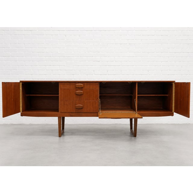 Mid Century Modern Teak Credenza by Stonehill | Long Sideboard With Funky Sculpted Pulls and Sled Legs, Made in England, C. 1960’s For Sale In New York - Image 6 of 18