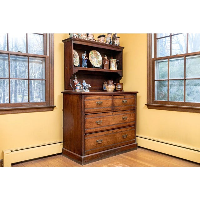 A two-part Victorian period cupboard storage cabinet with a single shelf, two long drawers, two short darers and original...