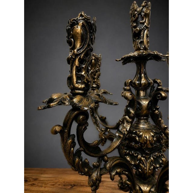 Discover the dark allure of this unique gothic-inspired candelabra, masterfully crafted in bronze to capture a distinct...