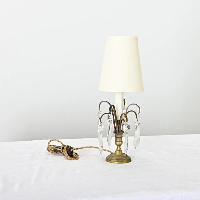 Dimensions: 16 ¼” H x 6” W x 6” D A darling, petite table lamp from late 19th century France rising from a brass...