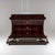 Large Empire mahogany-veneered chest of drawers raised on an exceptionally crafted base supported by chimera figures with...