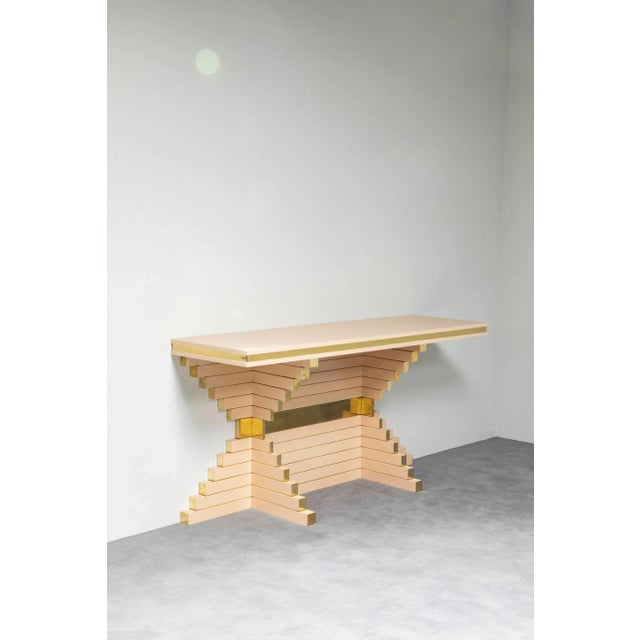 One of a kind outstanding console table designed by Alain Delon for Maison Jansen, it features a skyscraper style...