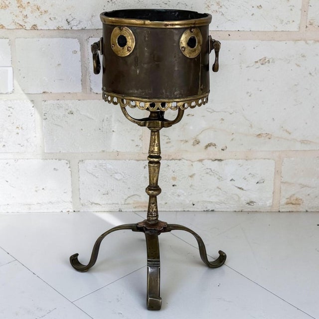 18th Century Dutch Bronze & Copper Tea Kettle Warmer is an intriguing artifact, hand-crafted from bronze and copper to...