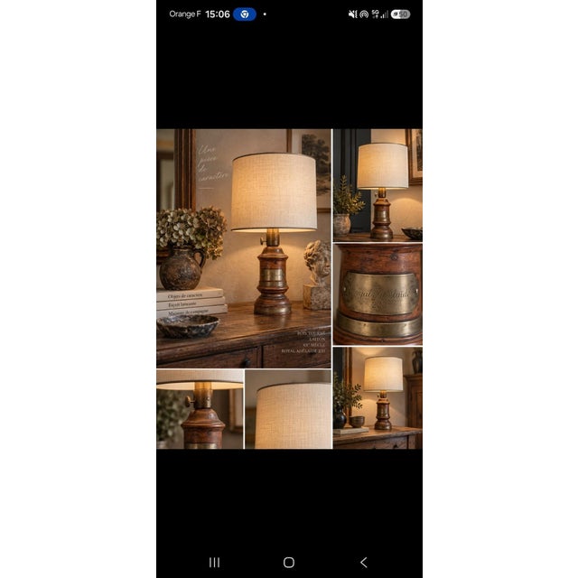 A turned wooden baluster-shaped floor lamp, patinated in warm brown tones. The stem features several rings and bands of...