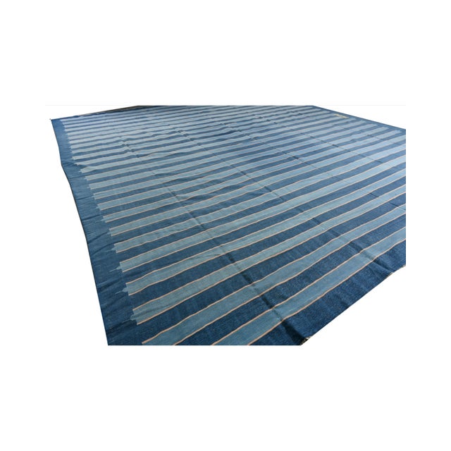 This vintage 14x15 Dhurrie is an exciting new entry in Rug & Kilim's esteemed flat weave collection. Handwoven in cotton,...