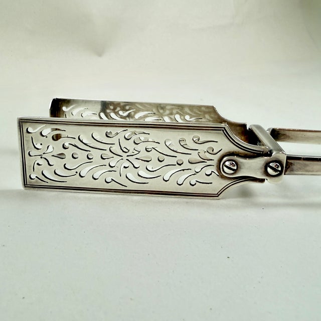 From the Victorian Era, a English hand-made Sterling Silver Asparagus master serving tongs. London, circa 1838, In The...