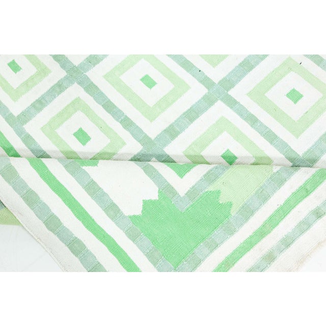 Vintage Indian Dhurrie Green Beige Rug. Size: 6'2" × 9'3" (187 × 281 cm) A bold and refreshing interpretation of...
