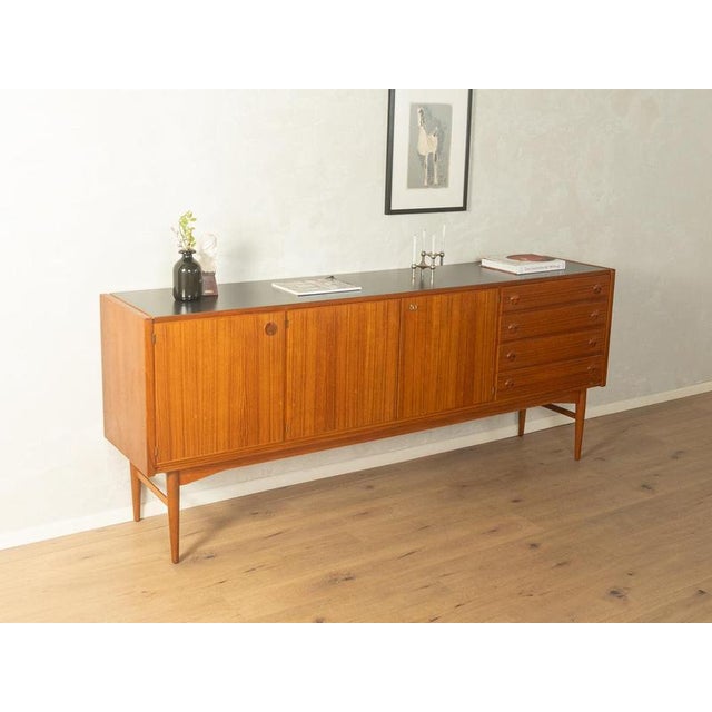 1960s sideboard excellent craftsmanshiphigh-quality materialssolid wood drawersMade in Denmark Width: 222 cm Height: 91 cm...