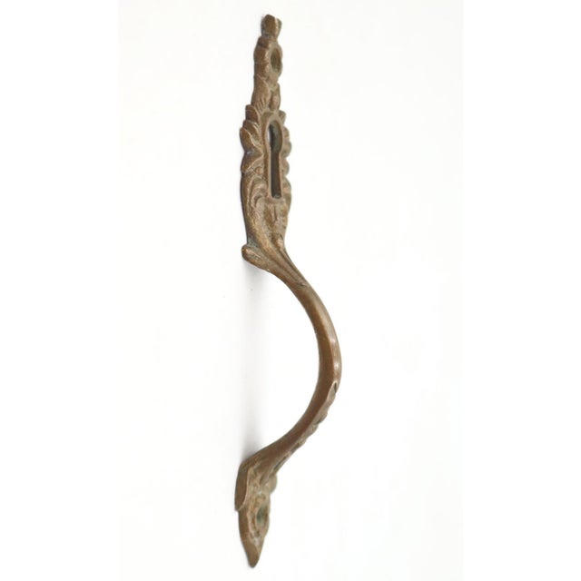 Victorian style music cabinet finger pull made of brass with a patina finish. The original mounting screws are not...
