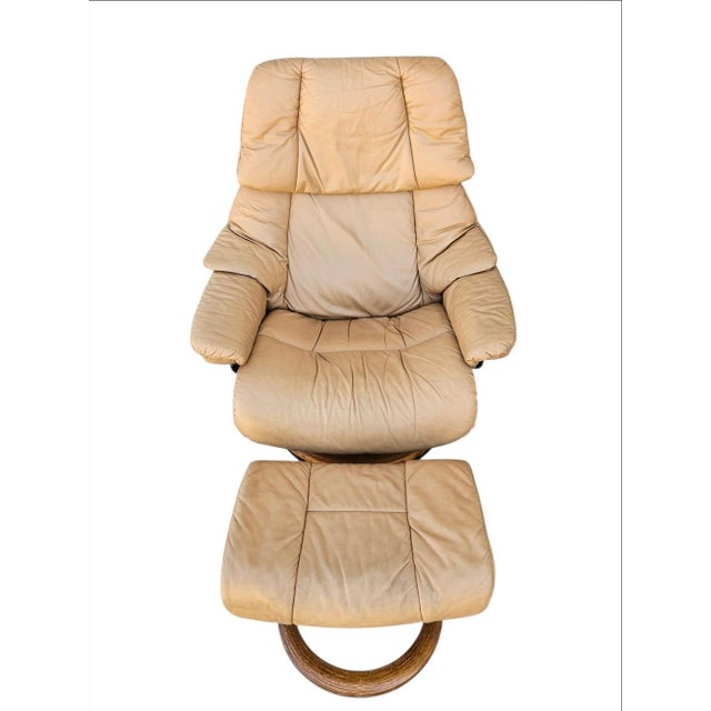 A classic Ekornes Stressless Reno recliner and matching ottoman, crafted in Norway. Known for its exceptional comfort and...
