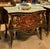 Make a statement with this magnificent French bombe commode, showcasing exceptional floral marquetry, graceful serpentine...