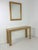 Set of two Italian console tables and mirror in the style of Aldo Tura, 1970s Clean and elegant lines, gold-plated metal...