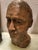 Original colored chalkware head sculpture of a man" (Head - male portrait) sculpted in terracotta. signed M.S.H 1999