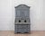 Made in Scandinavia in the eighteenth century, this two-part bureau has a blue painted finish and fine carvings. The two-...