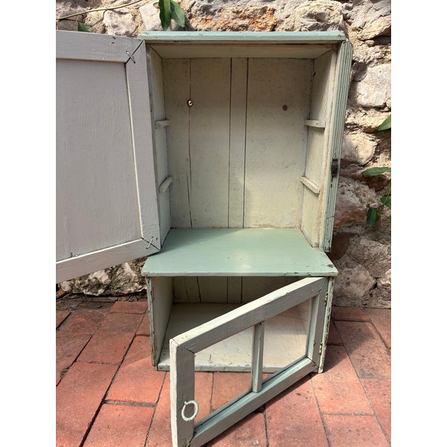 This is a charming little rustic wall cabinet, probably made somewhere in Eastern Europe. It has its original arsenic...