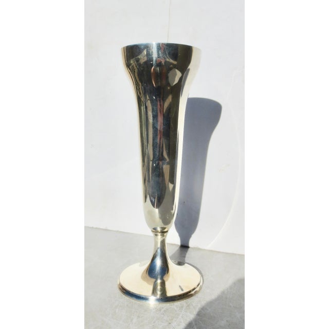 Sterling silver trumpet vase with monogram M B E. The measurements are 12" tall and 4.5" in diameter. Hallmarked 9 oz....