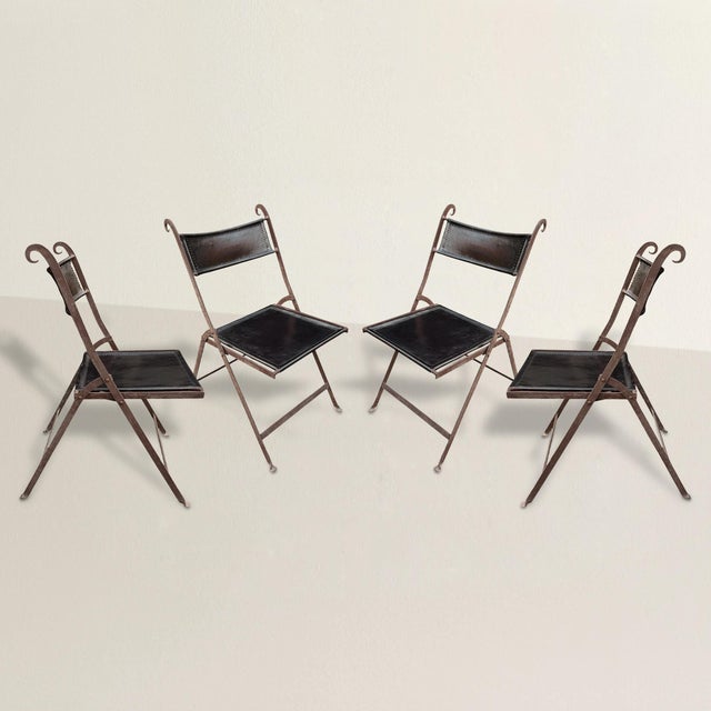 A study in restraint and attitude, this set of four mid-20th-century Italian Modern folding chairs captures the era’s...