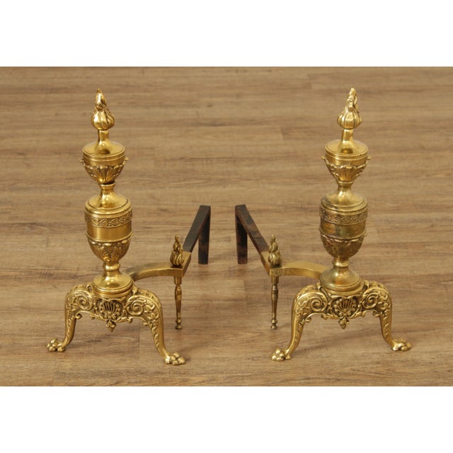 High Quality Vintage Pair of Brass Andirons Having Heavily Embossed Neoclassical Designs with Paw Feet