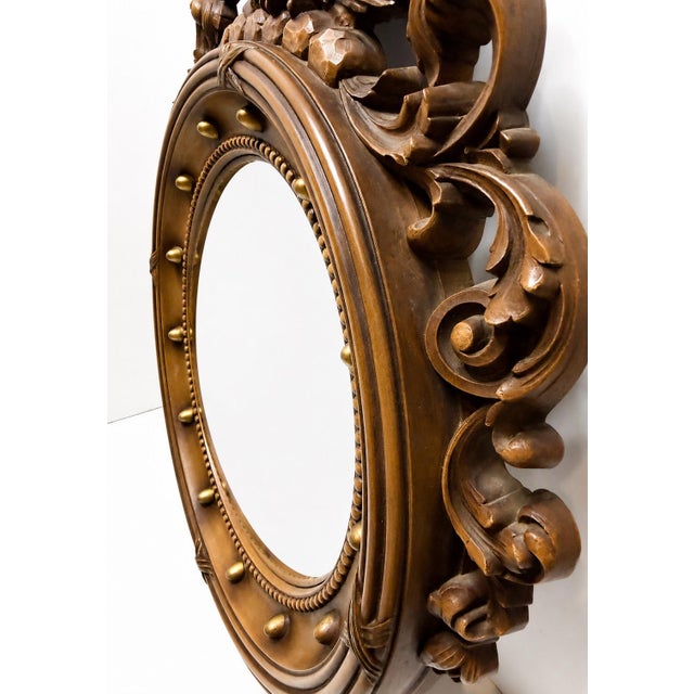 This Vintage Americana Federal Style Eagle Convex Resin Wall Mirror measures 22 inches long, 15 inches wide, and an inch...