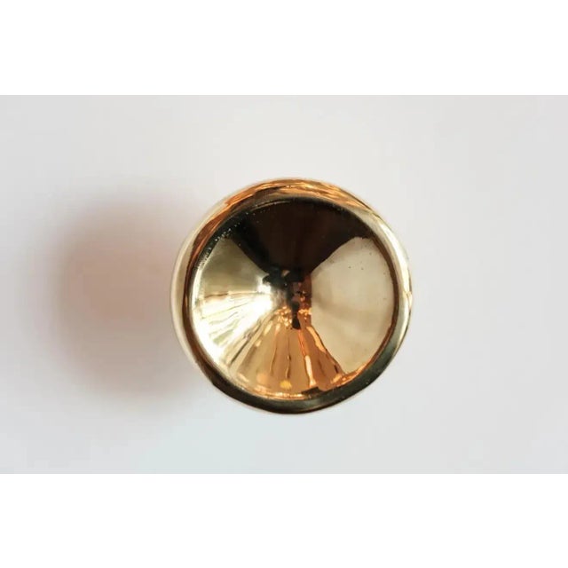 Carl Auböck Model #8040-1 polished brass knob. Designed in the 1950s, this versatile and Minimalist Viennese knob is...