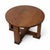 A charming Arts & Crafts circular oak low table, showcasing the honest craftsmanship and sturdy construction associated...