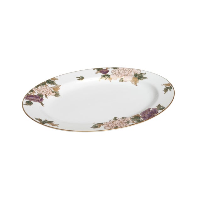 A Fitz and Floyd white porcelain platter from their "Cloisonne Peony" collection, circa 1990. The oval platter is...