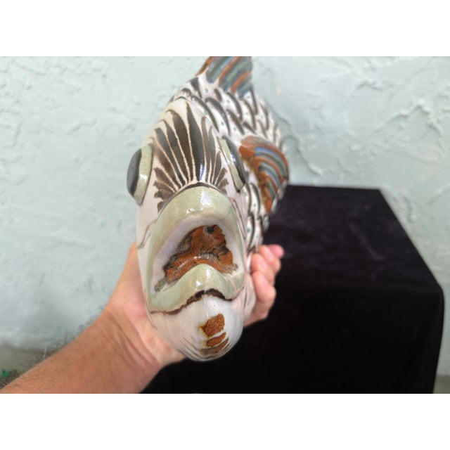 This is a vintage Ken Edwards Tonala stoneware pottery fish sculpture, a type of Mexican folk art. The piece is...