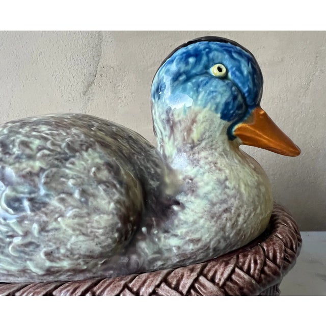 Ceramic majolica duck figure soup tureen made by Bordallo Pinheiro in Portugal in the 1960's. The set includes the basket...