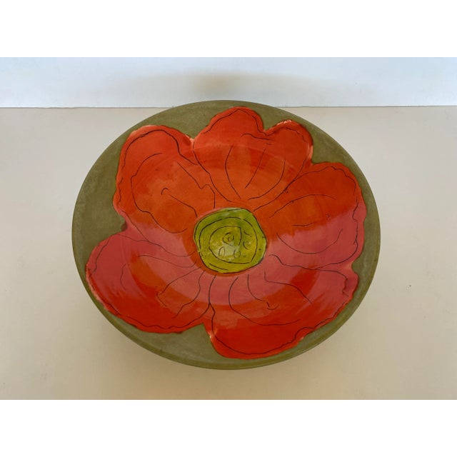 Beautiful vintage serving bowl with orange and yellow flower design. The bowl is signed on the bottom with the initials GJ.