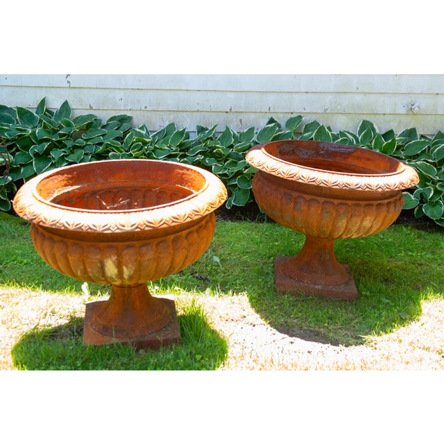 Pair of huge cast iron American urn planters. These are excellent reproductions of classical 19th century American urns....