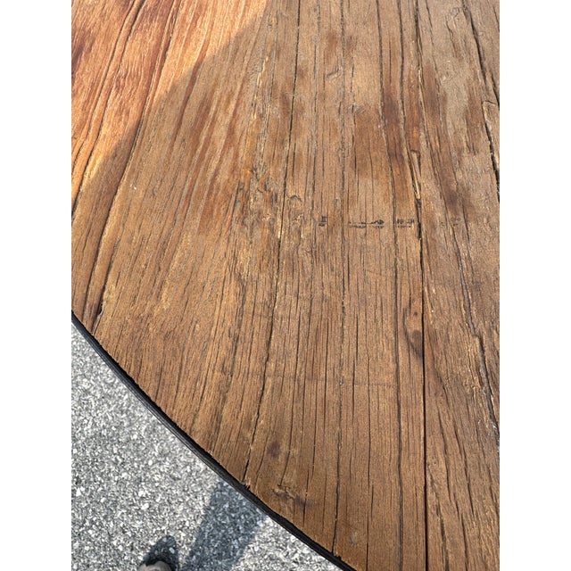 Stunning and rare table from RH’s retired collection. Beautiful salvaged solid wood and cast iron pedestal base boast form...