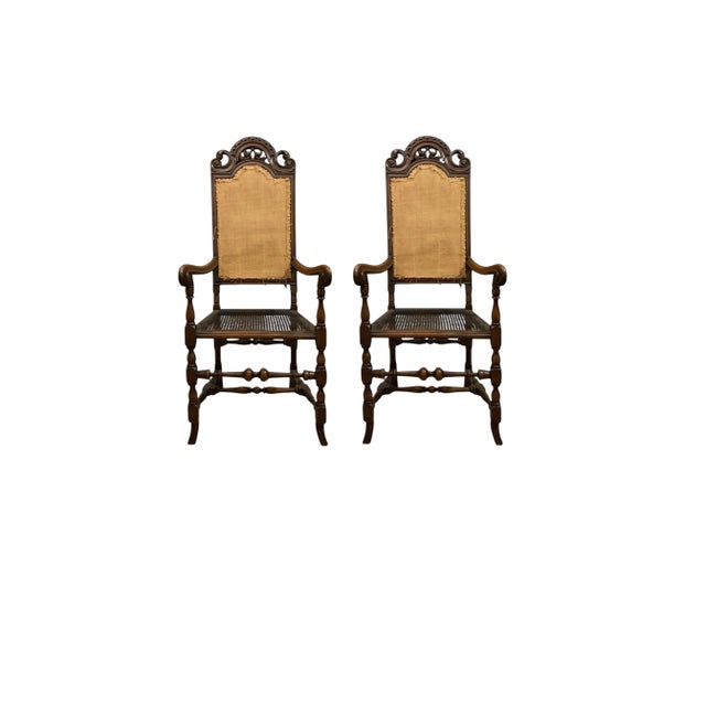 A pair of early 20th century European high-back armchairs with cane seats — 54 inches of old-world presence. Now $2,600...