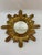 A gorgeous classic 16.75" Italian Giltwood Sunburst Wall Mirror from the 1960s. This hand crafted wood and gesso mirror...