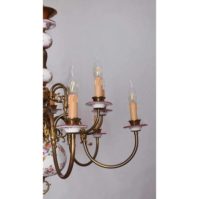 Combination of matte with polished brass and porcelain. The arms are decorated with fish. Completely new electrical...