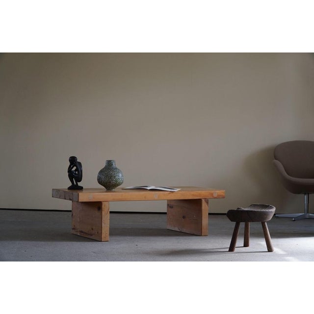 Mid-Century solid pine bench, made by Roland Wilhelmsson. This piece is stamped 1973, model Bamse. A great patina that...