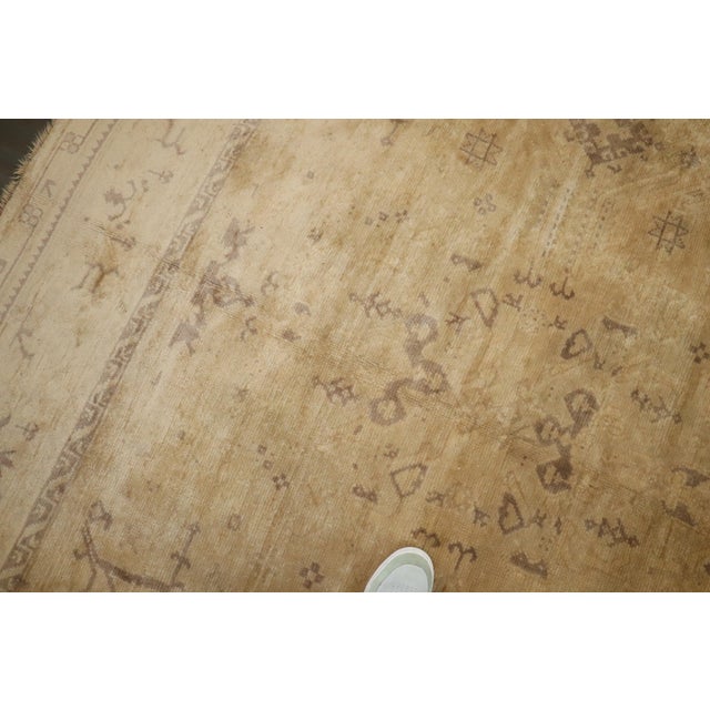 a mid-20th-century vintage Turkish oushak rug in neutral colors. Yellowish cream field with brown accent colors Details...