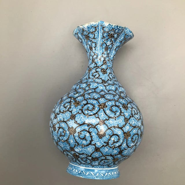 Floral mouth Persian mini vase vase signed by artist on the bottom.